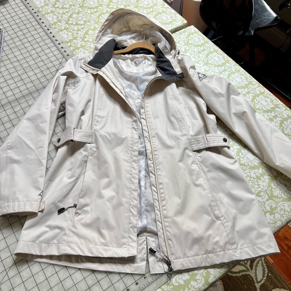 Rain coat. Never worn. Soft, comfortable , lg.